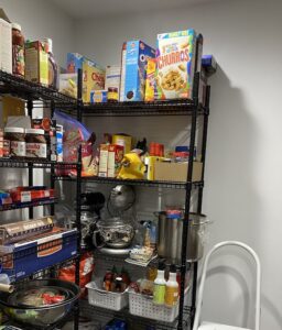 image of my open shelf pantry in a nook in my kitchen