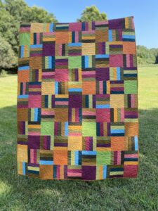 Interwoven quilt in autumn colors.