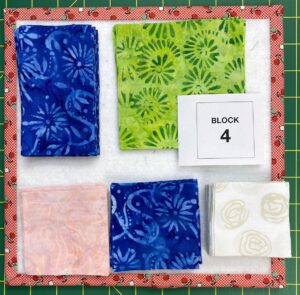 Small design board with squares and rectangles of fabric needed to make Mosaic Star blocks