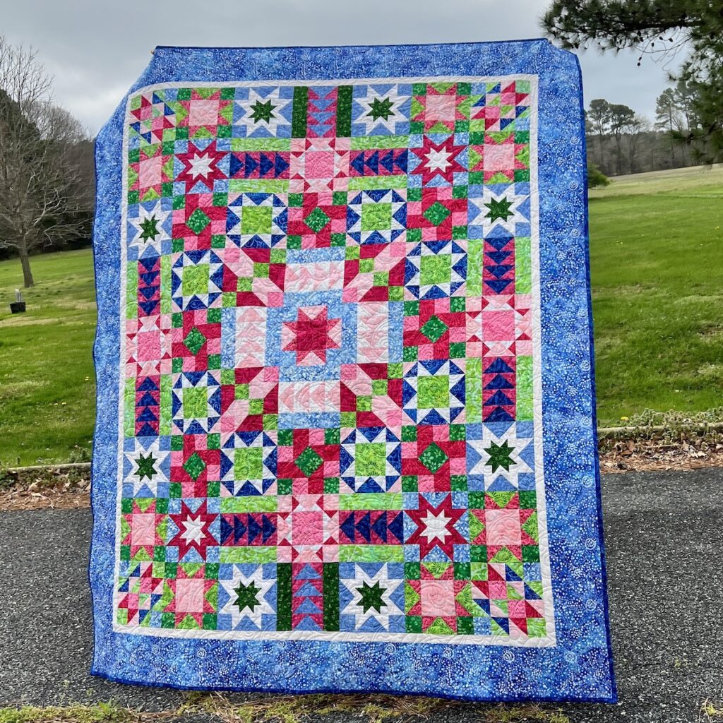 Photo of finished Stars in My Garden quilt