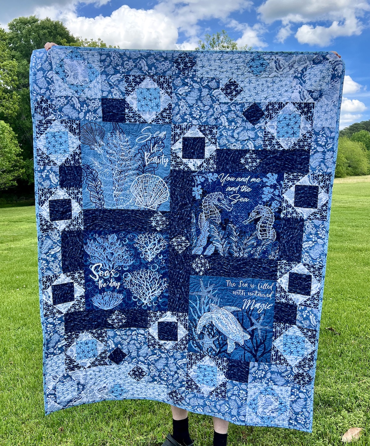Sea Magic quilt in blues and white featuring fabrics from Riley Blake's Ocean Oasis collection