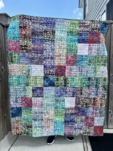 Lap sized quilt in colorful batiks fabrics