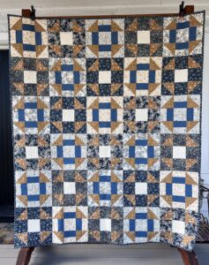 Photo of Dash & Fly quilt featuring two quilt blocks