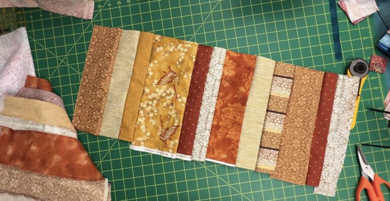 fabric panel made from strips of gold and copper colored fabrics